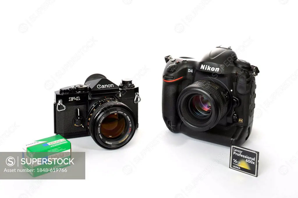 40 years of professional cameras, professional SLR Canon F-1, 1972, next to digital SLR Nikon D4, 2012, Fuji slide film and digital Compact Flash memo...