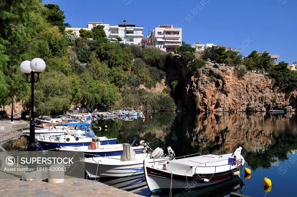 Boats in the harbour of Agios Nikolaos, Voulismeni Lake, Crete, Greece, Europe
