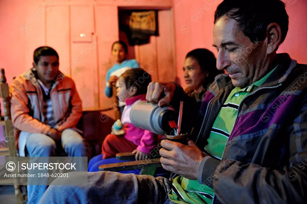 Man, father, drinking the traditional mate tea of Paraguay, family of smallholders, Comunidad Arroyito, Departamento Concepcion, Paraguay, South Ameri...