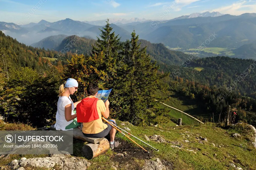 Female hikers taking a break on their way to lake Taubensee, Reit im Winkl, Chiemgau, Bavaria, Germany, Europe