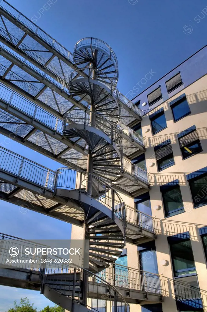 Modern office building, architecture, with a steel spiral staircase and bridges connecting the buildings, near Munich, Bavaria, Germany, Europe