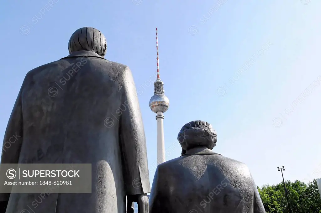 Statues of Karl Marx and Friedrich Engels, Fernsehturm television tower at the back, Berlin, Germany, Europe