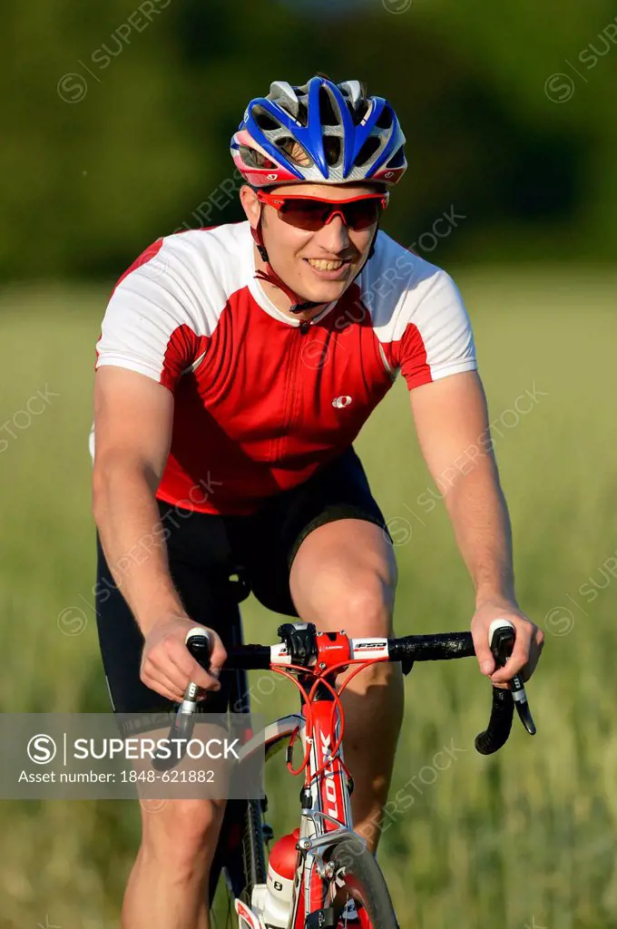 Racing cyclist riding a bicycle, Waiblingen, Baden-Wuerttemberg, Germany, Europe, PublicGround