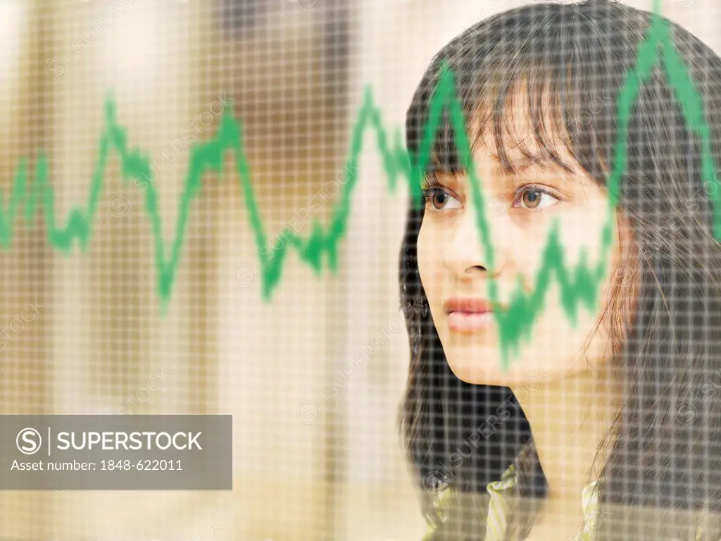 Business woman looking at a stock chart