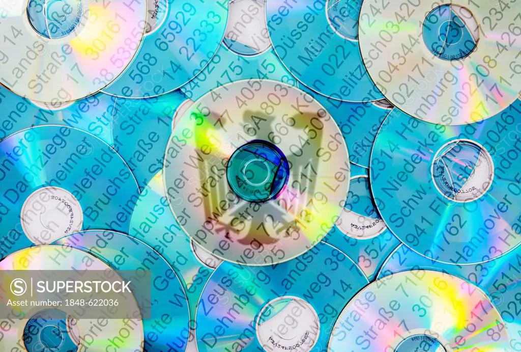 DVDs, address data and the federal eagle, symbolic image for a new German registration law, Meldegesetz