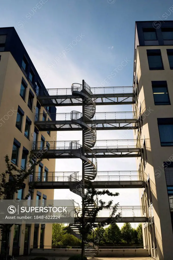 Modern office buildings, architecture, with a steel spiral staircase and bridges connecting the buildings, near Munich, Bavaria, Germany, Europe