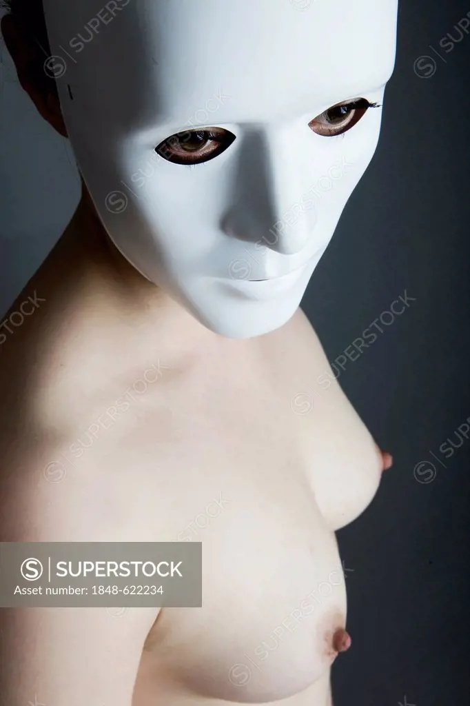Woman, naked, with white anonymous mask