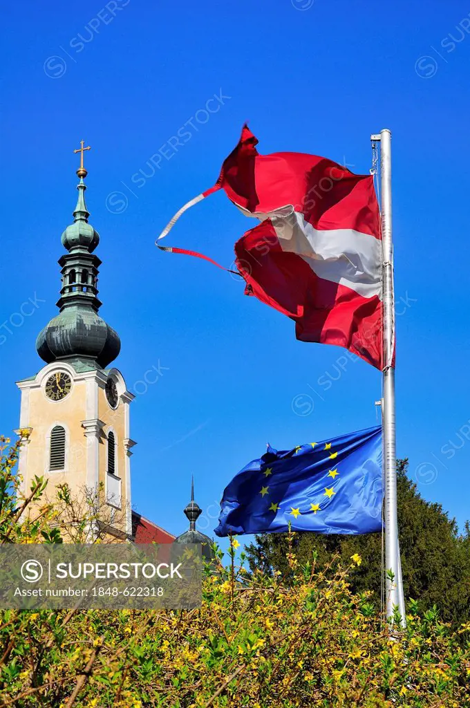 Spire of the church, Gobelsburg castle, an Austrian and an European flag, Langenlois, Lower Austria, Austria, Europe