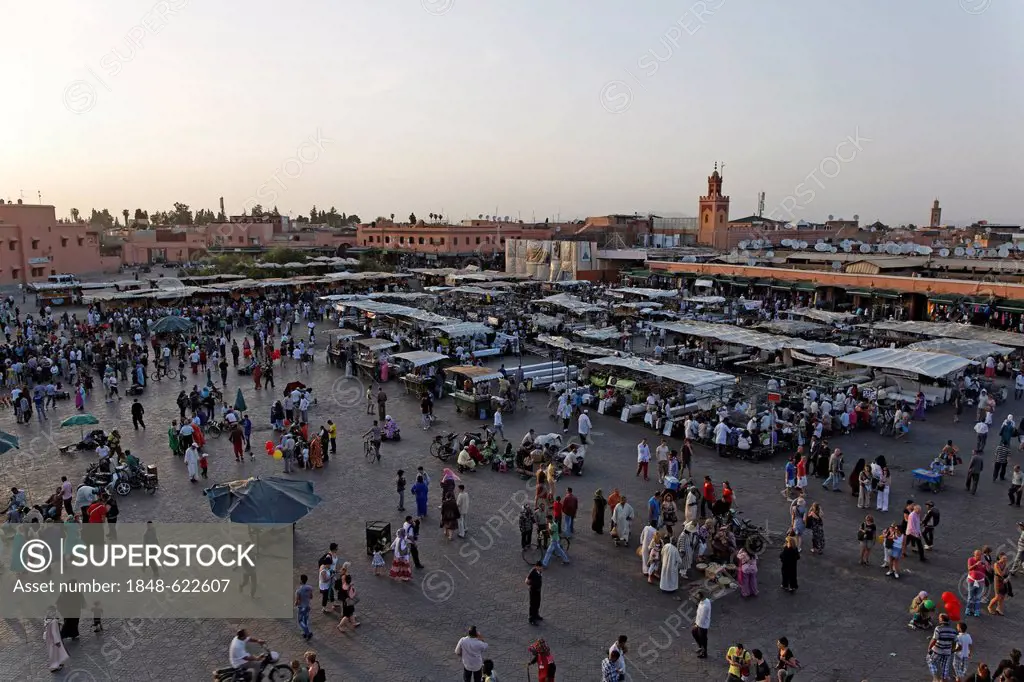 Hustle and bustle at the Djemaa el Fna or Jemaa el-Fnaa square, UNESCO World Heritage Site, Marrakech, Marrakech-Tensift-El Haouz, Morocco, Mahgreb, N...