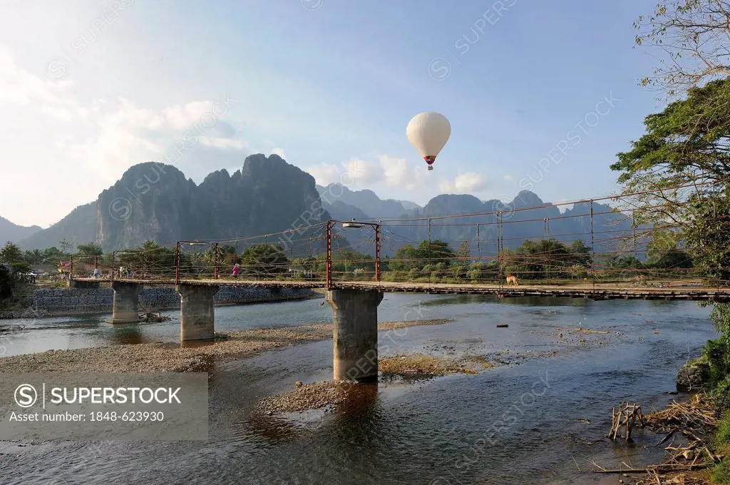 Hot air balloon, karst mountain range at the back, Vang Vieng, Laos, Southeast Asia