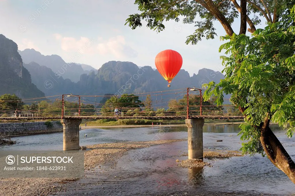 Hot air balloon, karst mountain range at the back, Vang Vieng, Laos, Southeast Asia