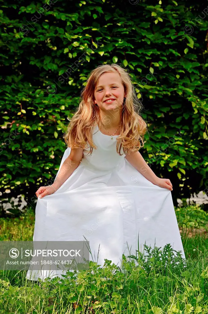 Girl, 9 years, in a white First Communion dress, Muensterland region, North Rhine-Westphalia, Germany, Europe