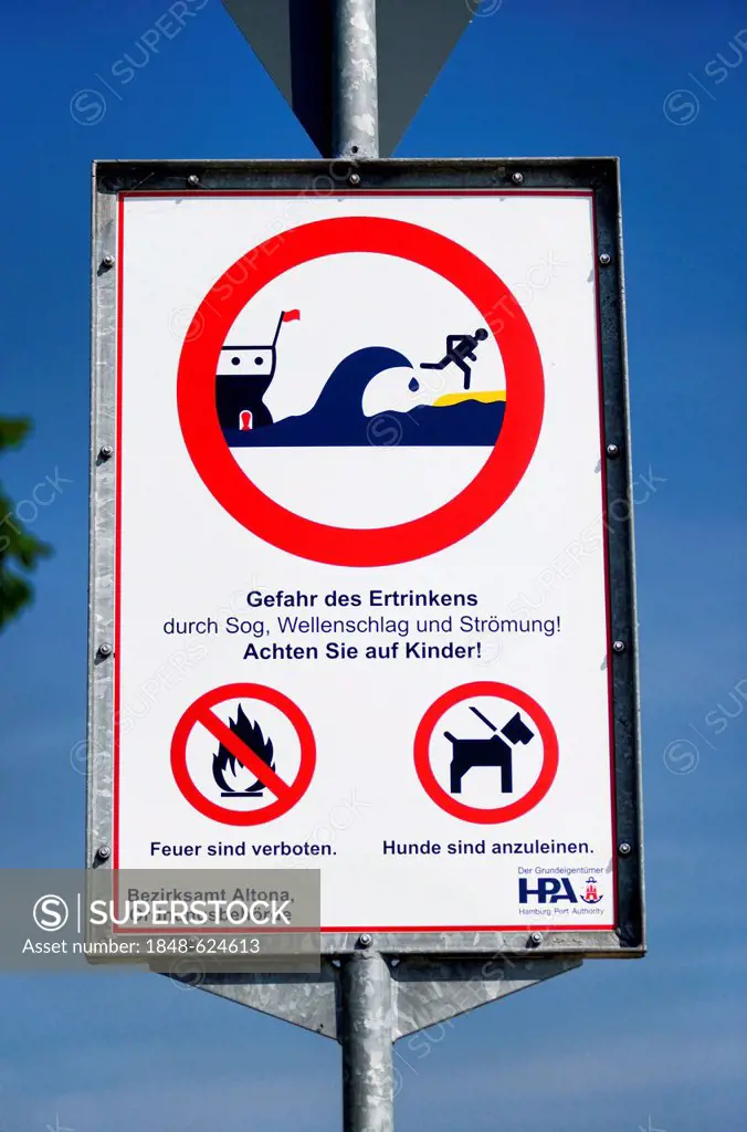 Danger sign warning of waves on the beach at Blankenese in Hamburg, Germany, Europe