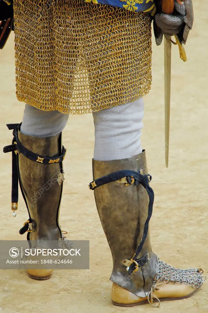 Boots and chain mail, detail view, people in medieval costumes representing their respective districts at the Palio, Piazza del Campo, Siena, Tuscany,...
