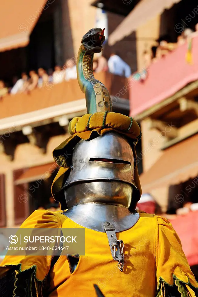 Knight's armour, people dressed in medieval costumes representing their respective city districts at the Palio, Piazza del Campo square, Siena, Tuscan...