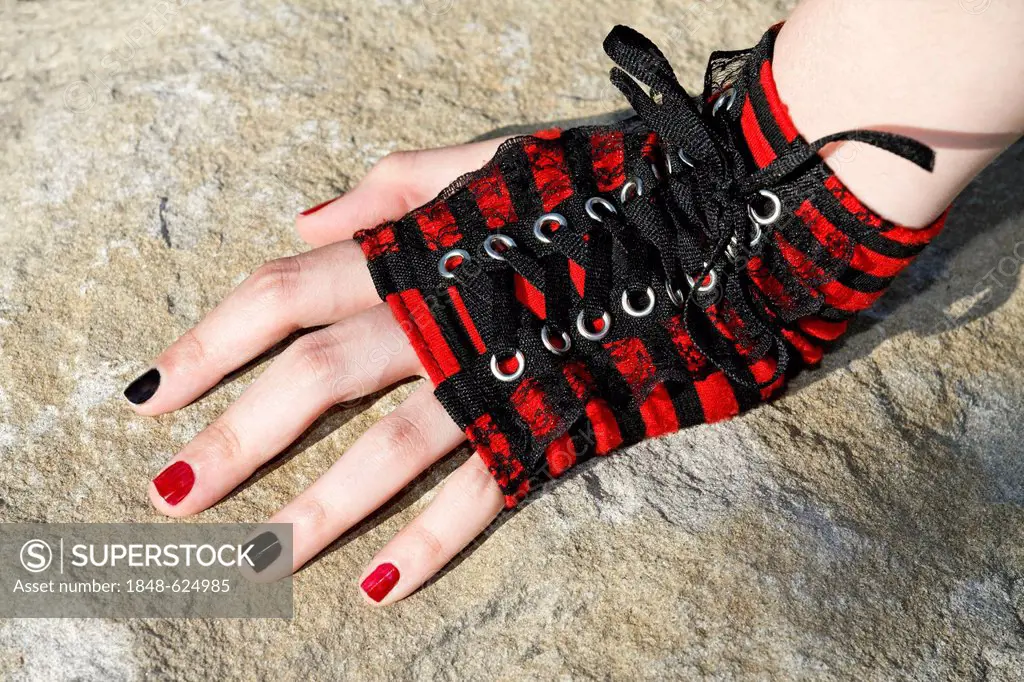 Hand of a teenager wearing corseted fingerless gloves with painted fingernails, cosplayer, Japan Day, Duesseldorf, North Rhine-Westphalia, Germany Eur...