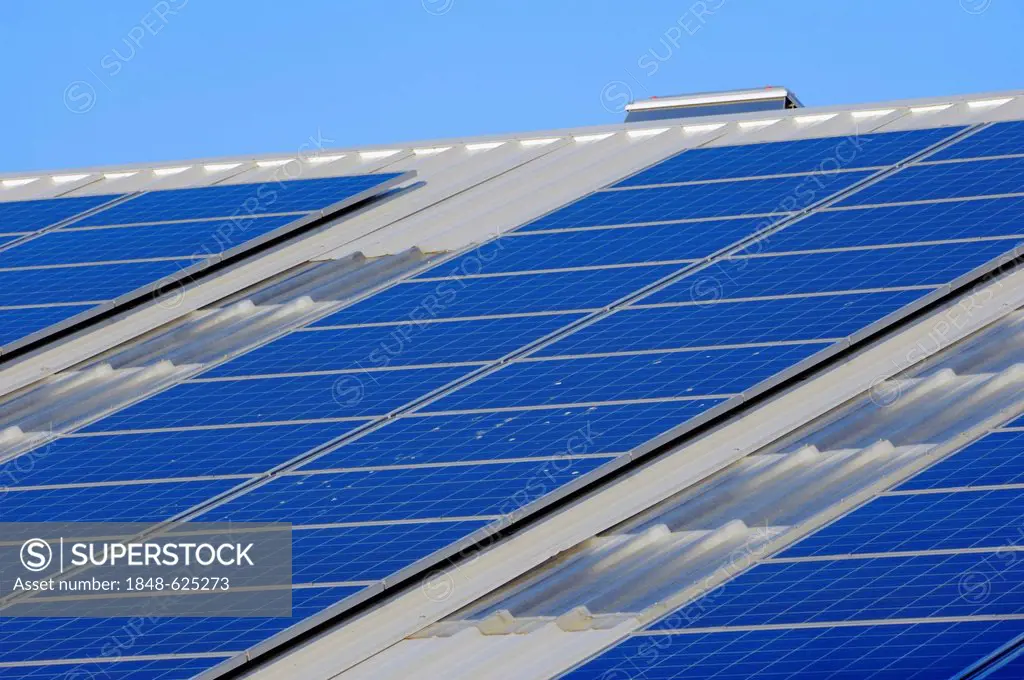 Photovoltaic system, solar cells, solar panels on the roof of a company, North Rhine-Westphalia, Germany, Europe, PublicGround