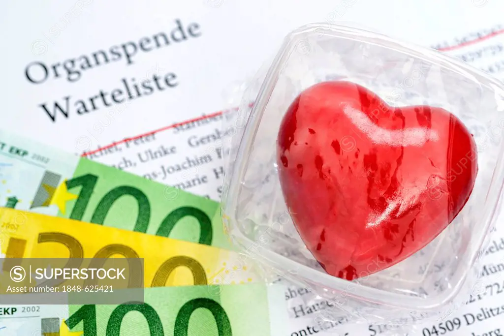 Heart in food storage container on organ donation waiting list, symbolic image for organ donation