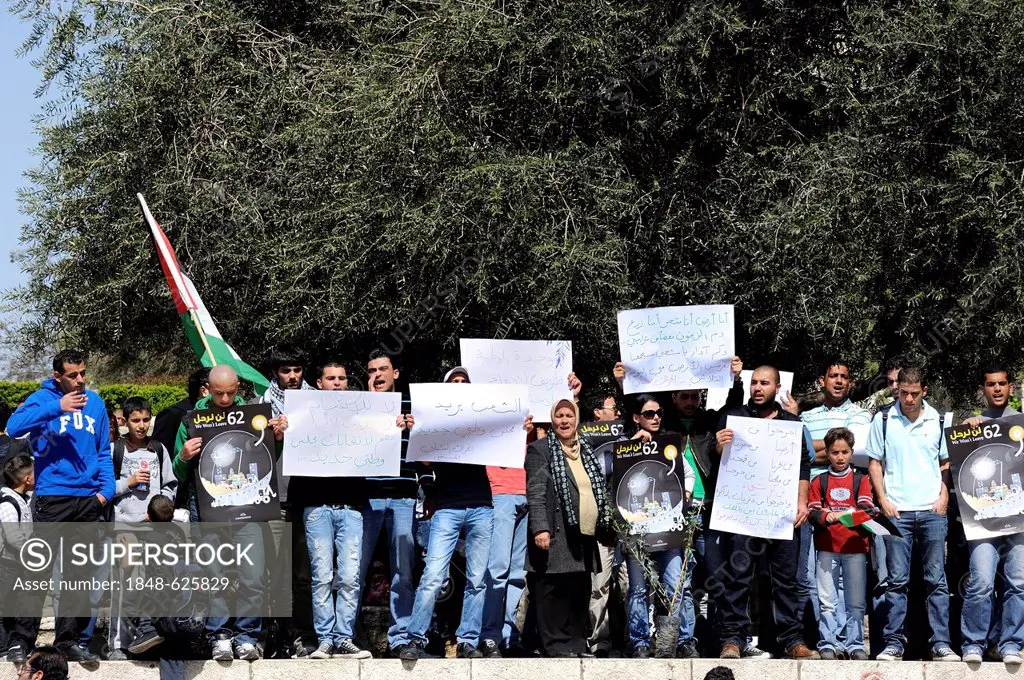 Palestinians demonstrating peacefully with placards and signboards on the steps outside the Damascus Gate against the settlement policy of Israel, Jer...