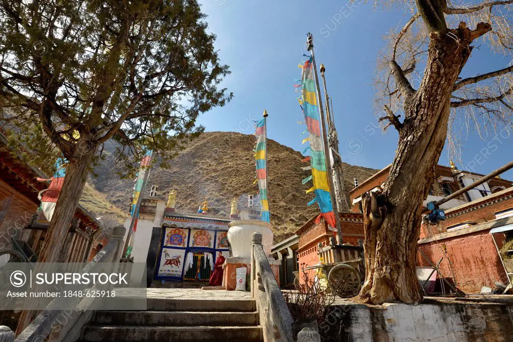 Tibetan Buddhism, stupa and monastery buildings with prayer flags built in the traditional architectural style, Labrang Monastery, Xiahe, Gansu, forme...