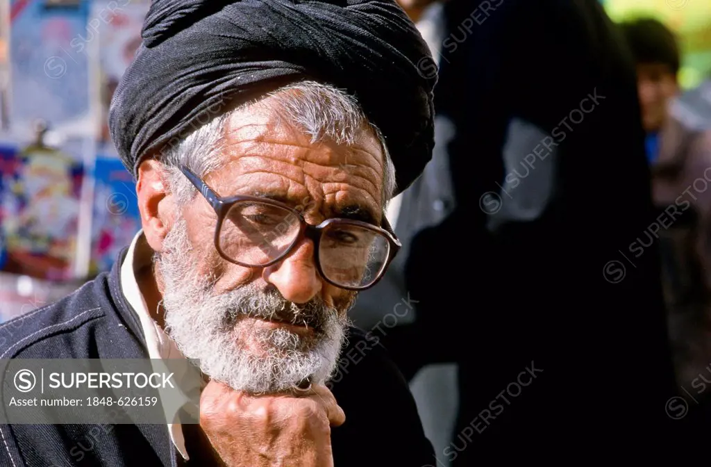 Man with glasses, pensive, bazar of Shiraz, Iran, Western Asia