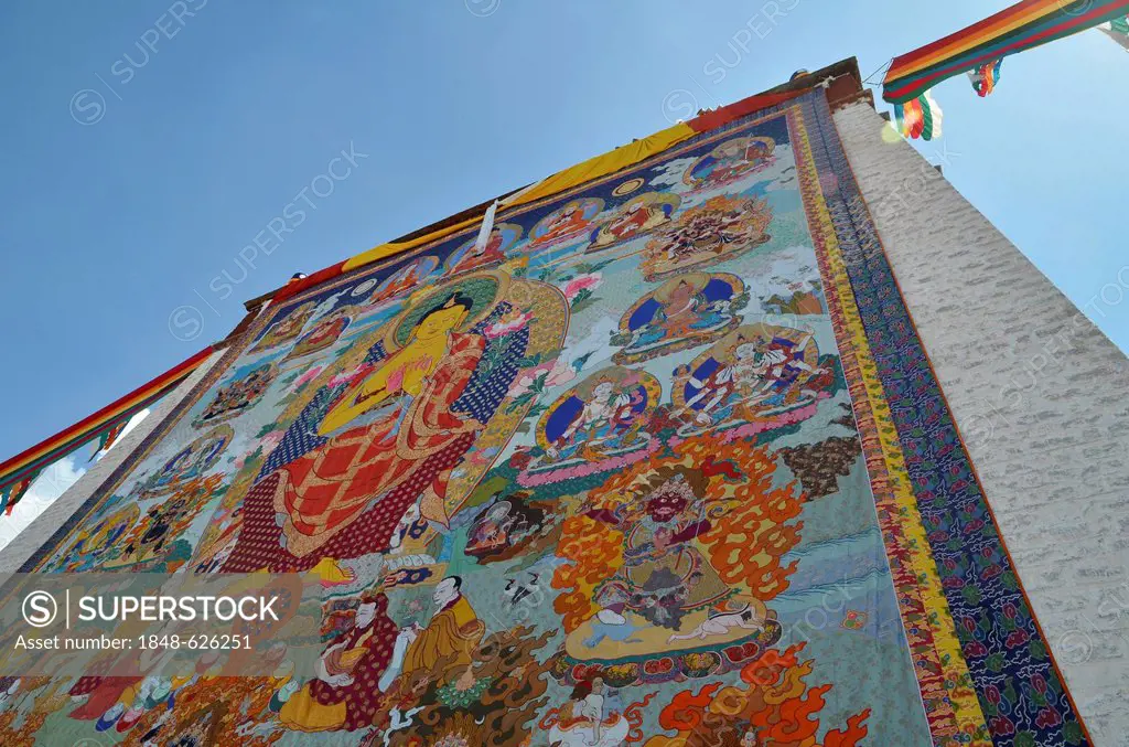 Tibetan Buddhism, religious fabric image, large Thangka of Sera, revealing of the Buddha image, at the Shoton or Choedoen or Yoghurt Festival, Sera Mo...