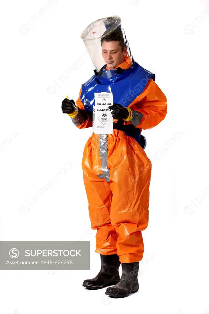 Firefighter wearing a protective suit for disease control holding a container for gathering samples, professional firefighter from the Berufsfeuerwehr...