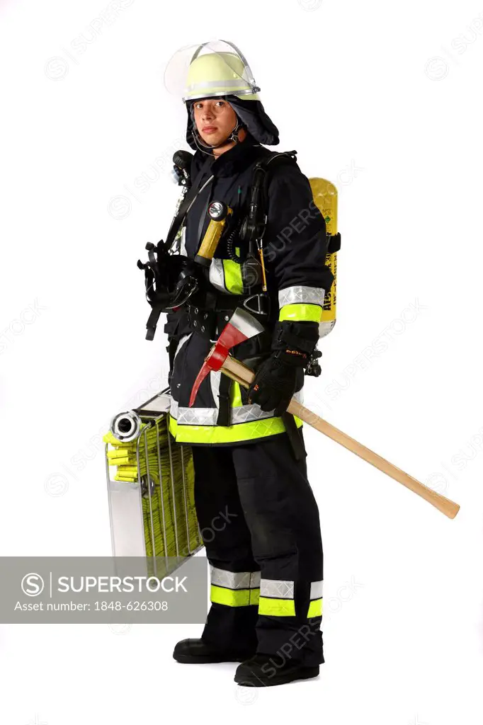 Fireman, part of a response squad for firefighting, with protective clothing made of Nomex, a helmet with a visor, a fire axe, respiratory protective ...