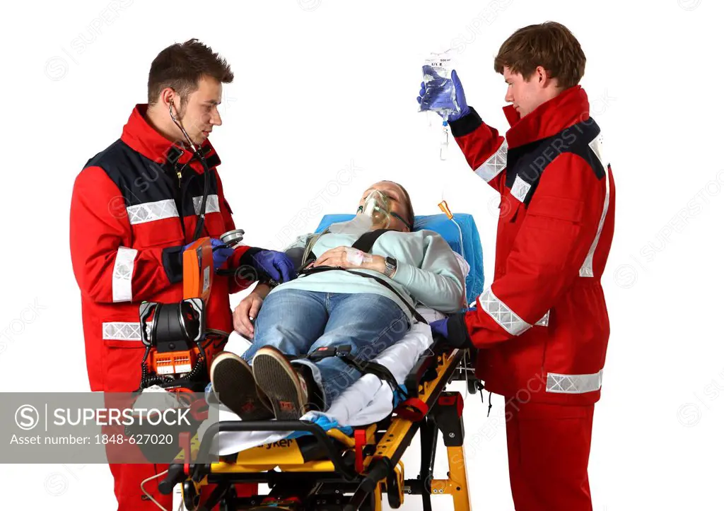 Paramedics recuscitating a patient and giving them an infusion on a wheeled stretcher, professional firefighters from the Berufsfeuerwehr Essen, Essen...