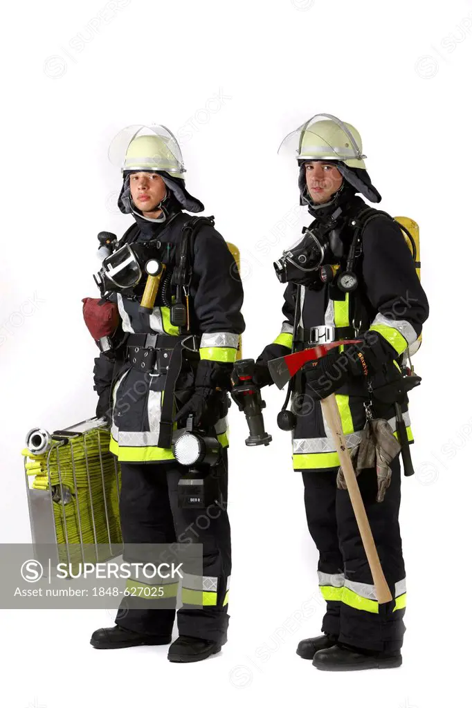 Firemen, part of a response squad for firefighting, with protective clothing made of Nomex, a helmet with a visor, a fire axe, respiratory protective ...