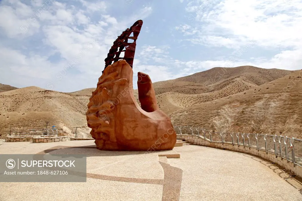Sculpture Awakening by artist Nah-Or Ran, representation of a hand forming a zero, sea-level indicator, on the road from Jerusalem to the Dead Sea, We...