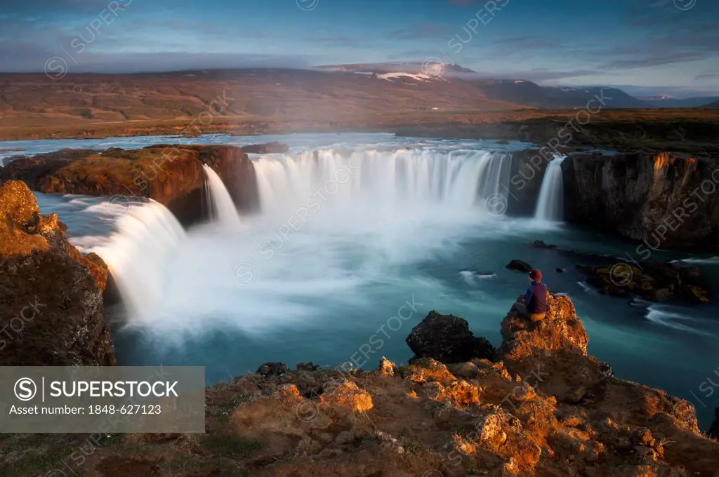 Woman at the Goðafoss waterfall on the Skjálfandafljót river, Ring Road, Norðurland eystra, Northeast Iceland, Iceland, Europe
