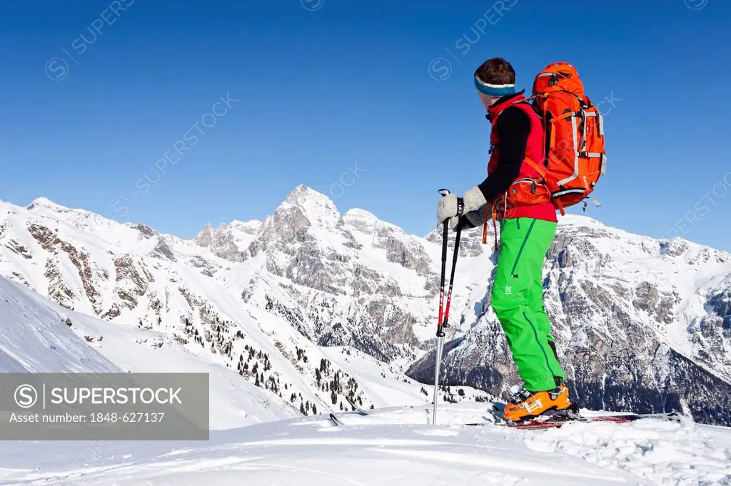 Backcountry skier during the ascent to the peak of Seeberspitz mountain in the Pflerschtal valley above Innerpflersch and the Toffring Alm alp, Tribul...