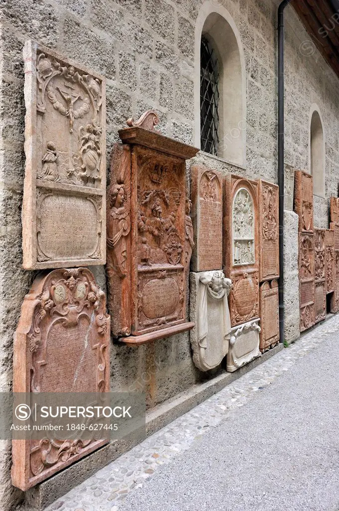 Old grave slabs with reliefs at St Peter's Cemetery, the oldest Christian burial site of Salzburg, St Peter's District, Salzburg, Salzburg province, A...