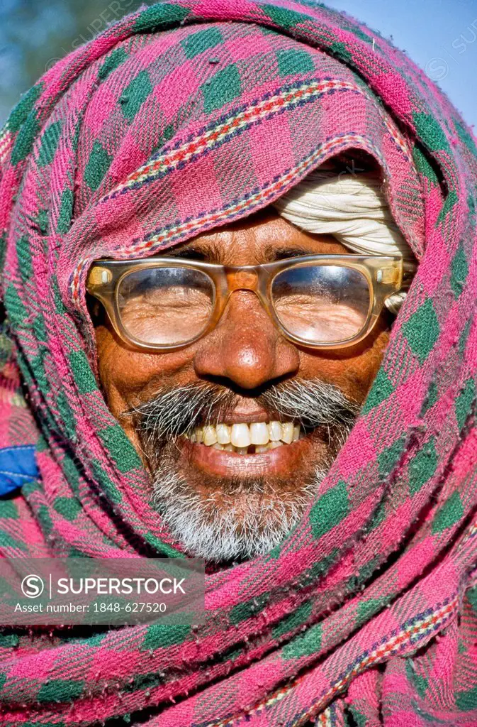 Farmer with glasses at Pushkar Camel Fair, portrait, Pushkar, India, Asia