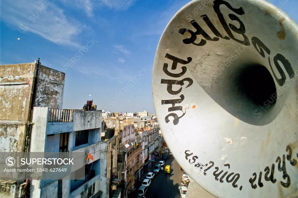 Loudspeakers playing music from the roofs during the annual kite festival, Ahmedabad, India, Asia