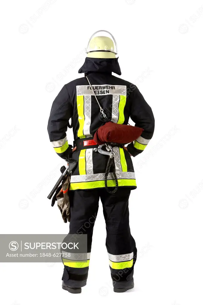 Firefighter with basic equipment, protective clothing made of Nomex, a helmet with a visor, an equipment belt, a flashlight, a two-way radio, gloves, ...