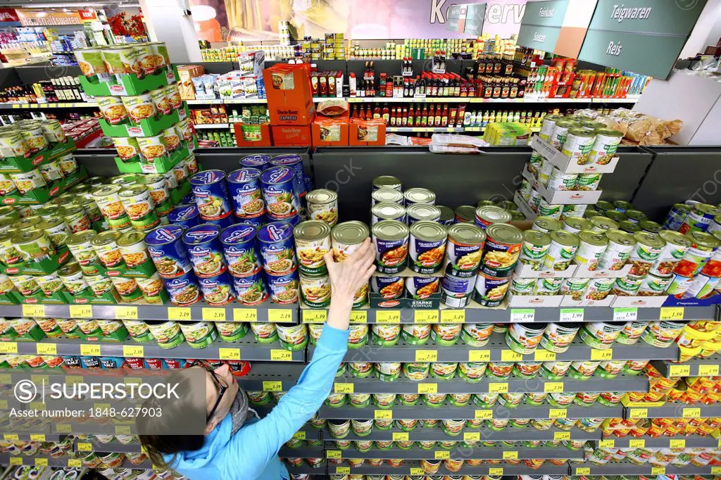 Woman shopping in the supermarket, food department, self-service, supermarket, Germany, Europe