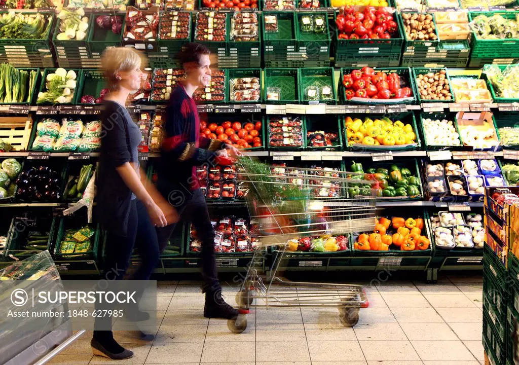 Fruit and vegetable section, couple buying vegetables, food hall, supermarket, Germany, Europe