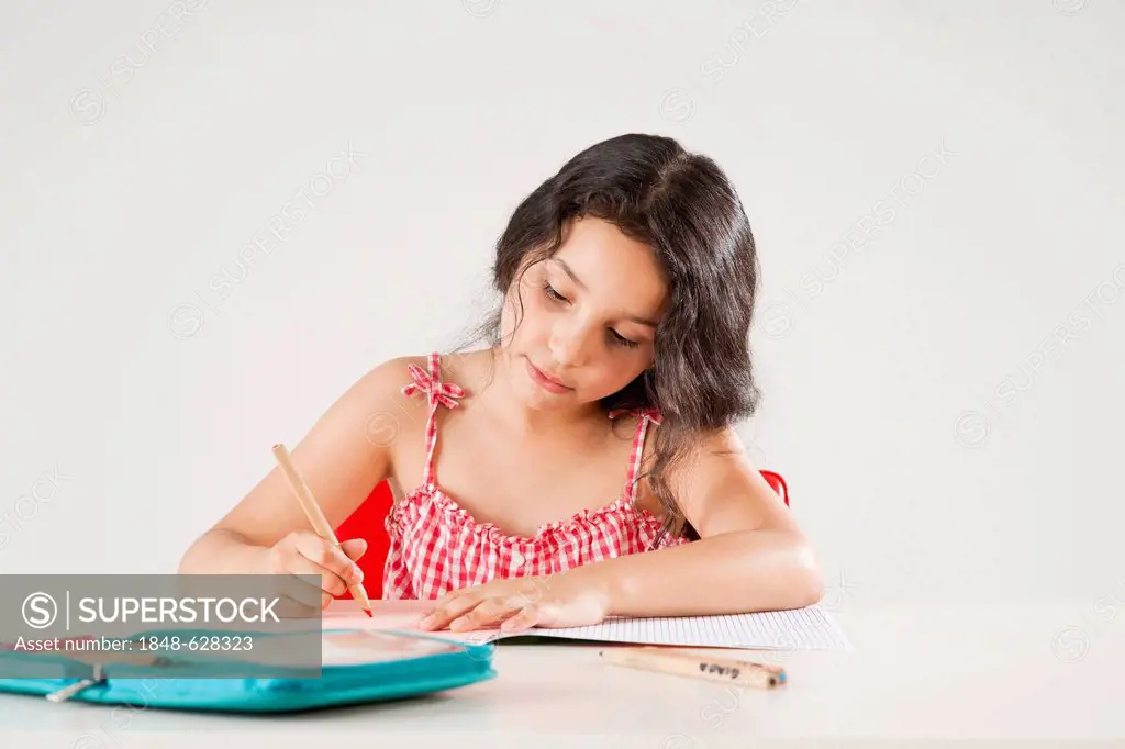 Girl doing her homework, learning