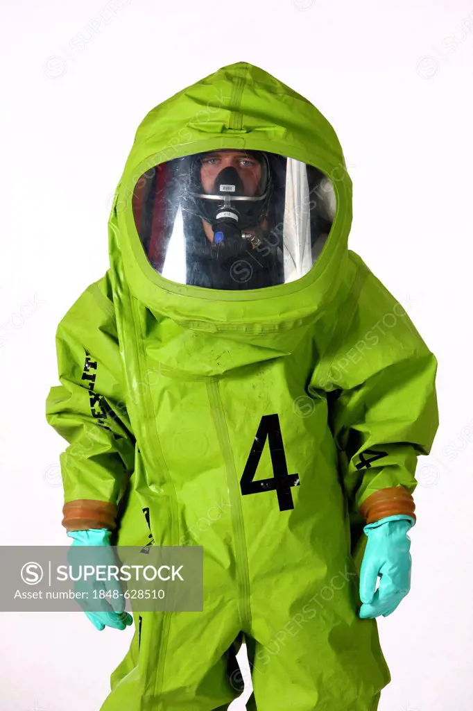 Firefighter wearing a chemical protective suit with air supply from a compressed air breathing apparatus, professional firefighters from the Berufsfeu...
