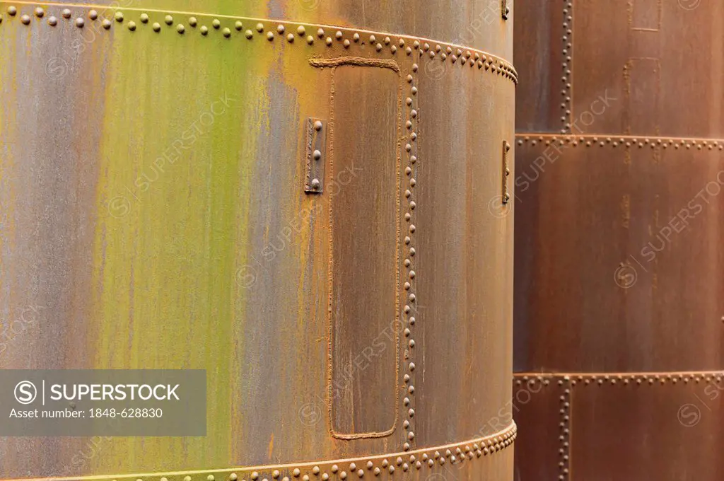 Riveted rusty steel containers, steelworks, mining