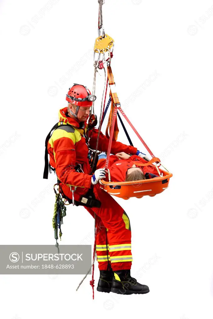 High-angle rescuer abseiling while rescuing a person in a rescue basket, a professional firefighter from the Berufsfeuerwehr Essen, Essen, North Rhine...