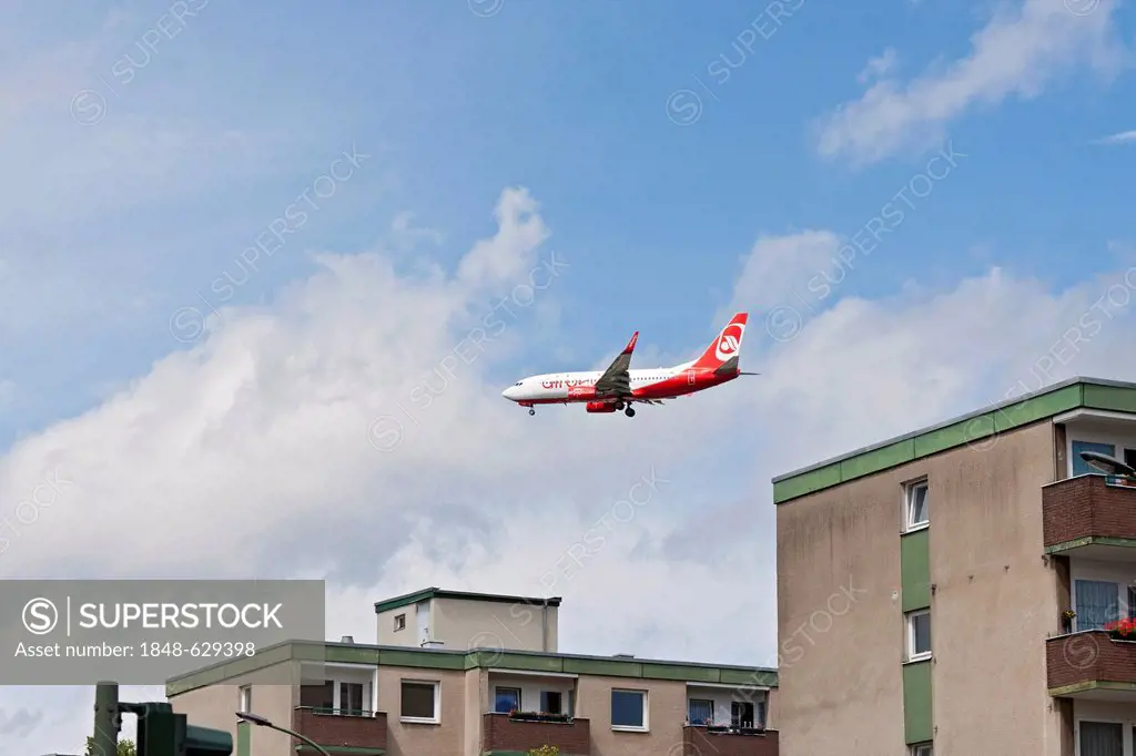 Passenger plane, Air Berlin, approaching the airport, flying above residential buildings, aircraft noise, Berlin, Germany, Europe