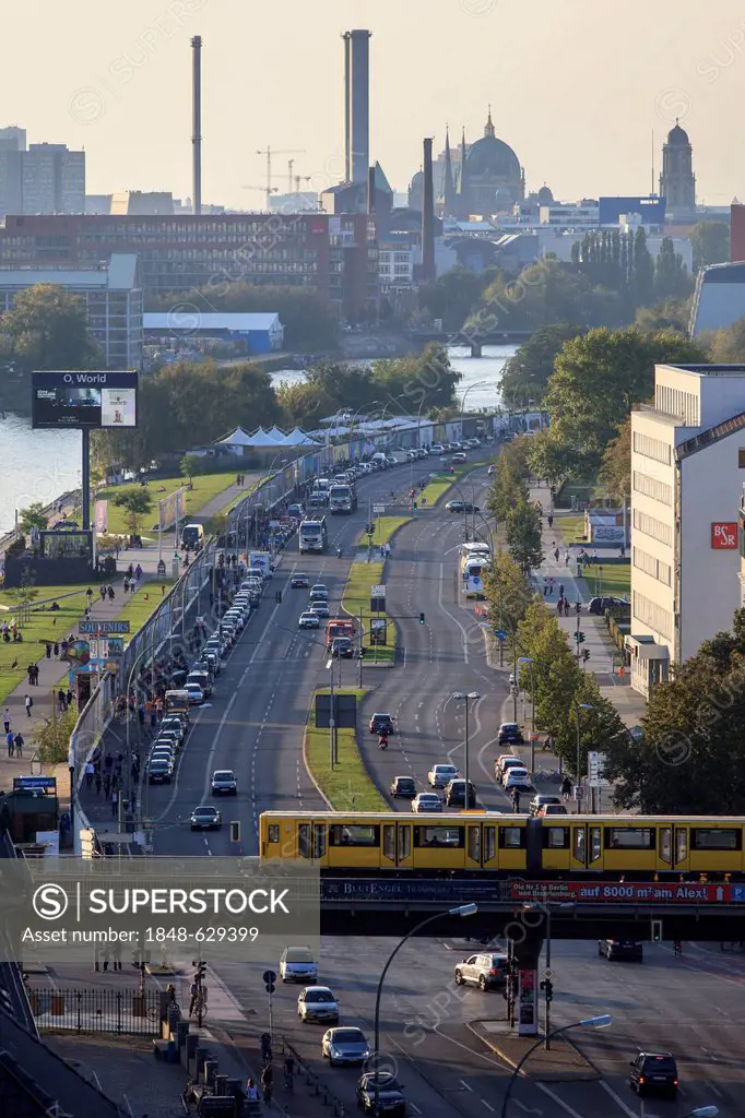 View over Berlin along the Muehlenstrasse street and the Eastside Gallery, the former death strip between Kreuzberg and Friedrichshain towards Mitte d...