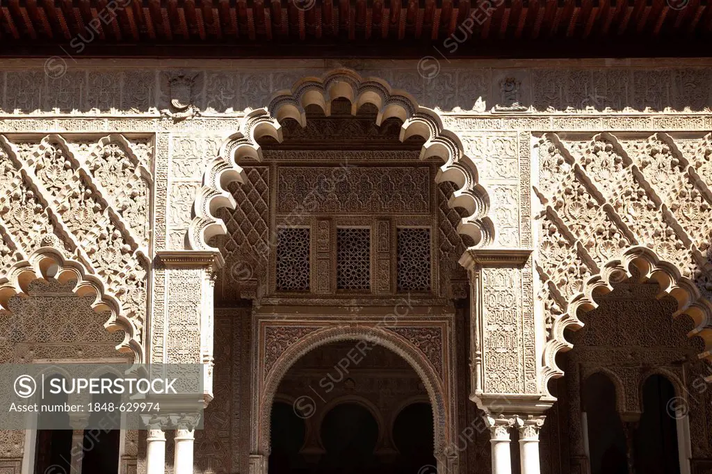 Moorish ornamentation on the Patio de las Doncellas in the Moorish King's Palace of Real Alcazar, UNESCO World Heritage Site, Seville, Andalusia, Spai...