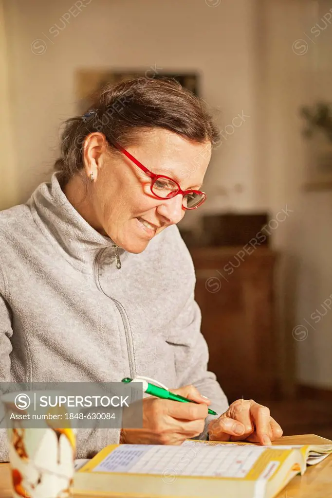 Woman with a puzzle book