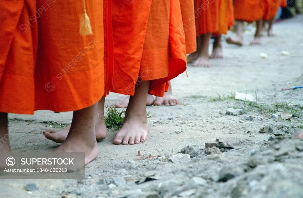Monks during their morning begging for alms in Luang Prabang, Laos, Southeast Asia