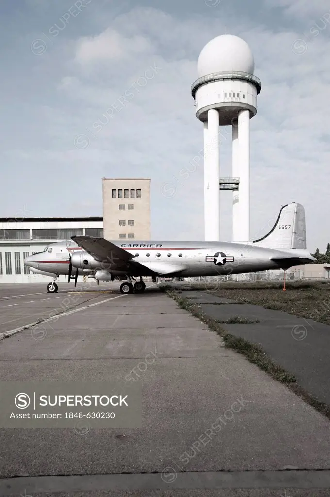 Radar tower and an old aircraft on the grounds of the former Tempelhof Airport, Berlin, Germany, Europe