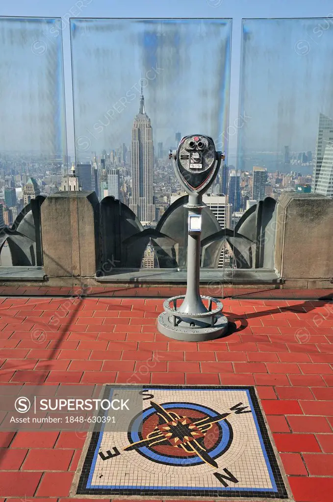 Coin-operated telescope at the observation deck Top of the Rock at the Rockefeller Center to the Empire State Building and Downtown Manhattan, New Yor...